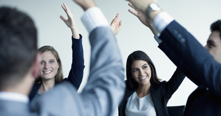 Group of people exercising at work