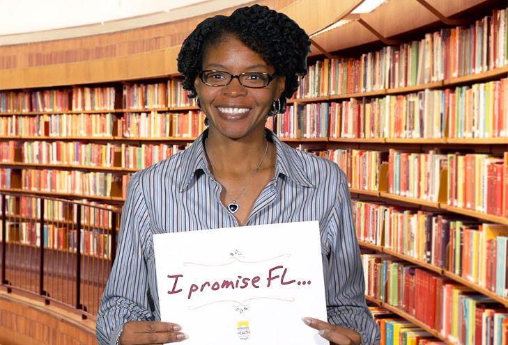 Woman holding a healthy promise pledge